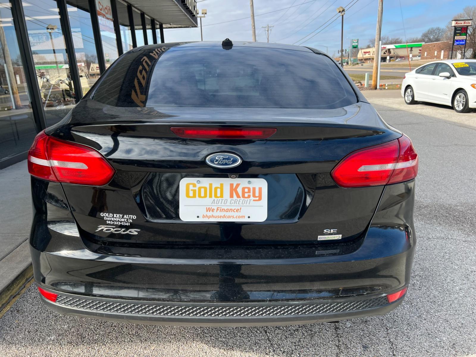 2018 Shadow Black Ford Focus SEDAN 4-DR (1FADP3FE7JL) with an 1.0L L3 engine, located at 1633 W Kimberly, Davenport, IA, 52806, (563) 323-5341, 41.559456, -90.598732 - Photo #4